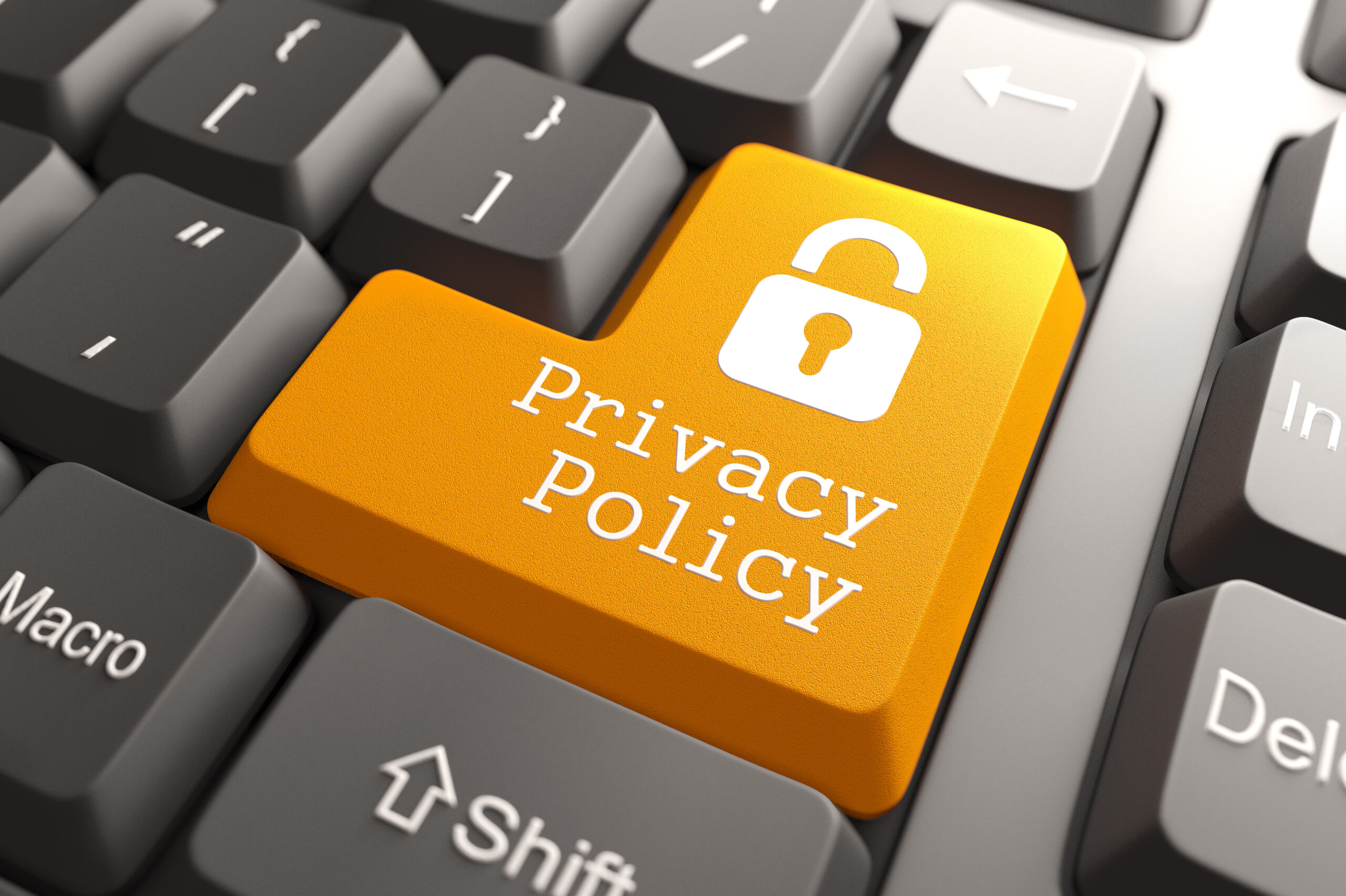 Orange Privacy Policy Button with Padlock Icon on Computer Keyboard. Internet Concept. 3D Render.